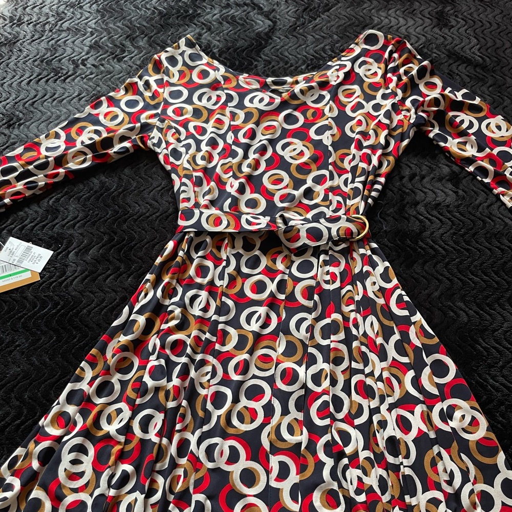 Multi color dress 90% Polyester and 5% Spandex.Belt closure.
